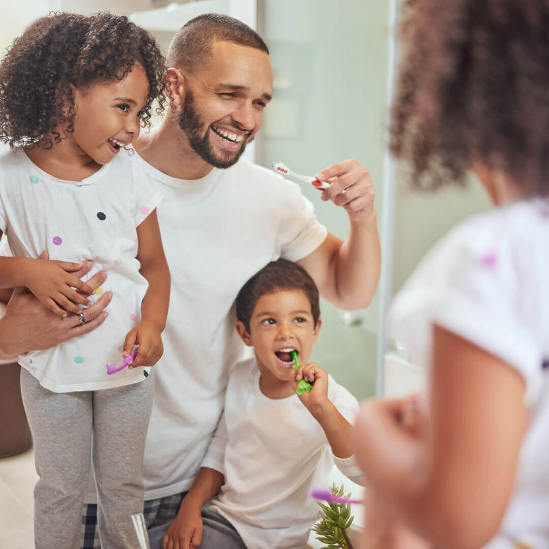 Smiling family with dental and vision insurance