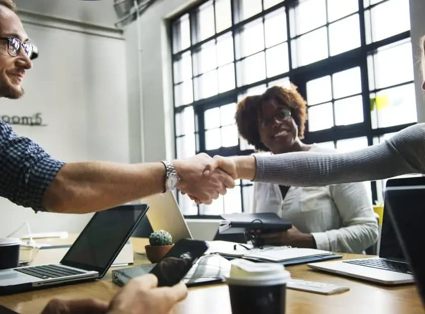 Business people shaking hands in agreement