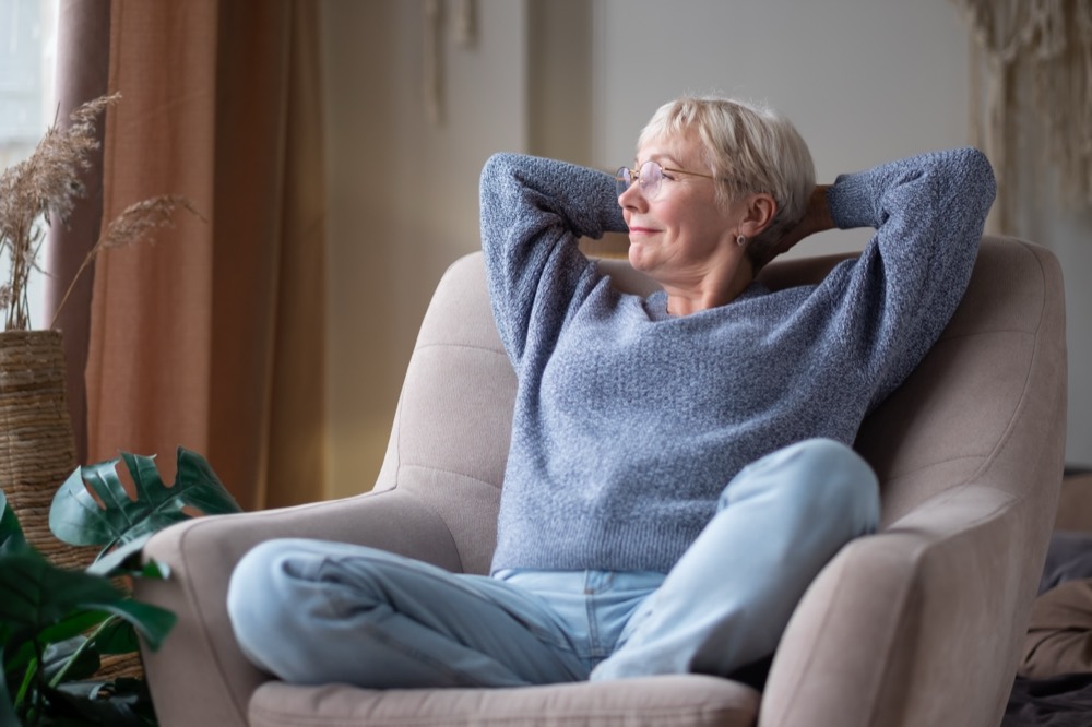 Retiree relaxing after choosing a plan with her Medicare broker
